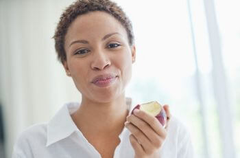 Woman Chewing Apple