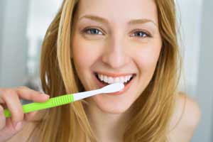 Woman brushing her teeth