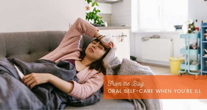 Woman feeling ill sleeping on the sofa