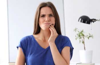 Woman having tooth pain